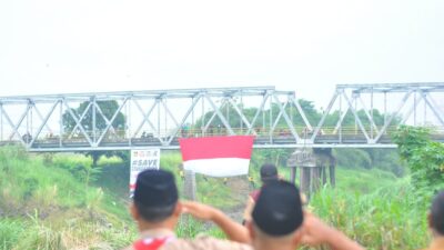 BENDERA MERAH PUTIH RAKSASA BERKIBAR DI BUMI ANGKAWIJAYA LOSARI